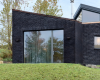 房产信息：纹理的黑砖支撑了DutchessCountyStudio中的喙状窗户