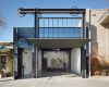 房产信息：汤姆昆迪格使用齿轮和滑轮吊起加利福尼亚画廊的外墙