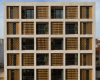房产信息：TDC Office在波浪形的木制百叶窗覆盖了网格公寓楼